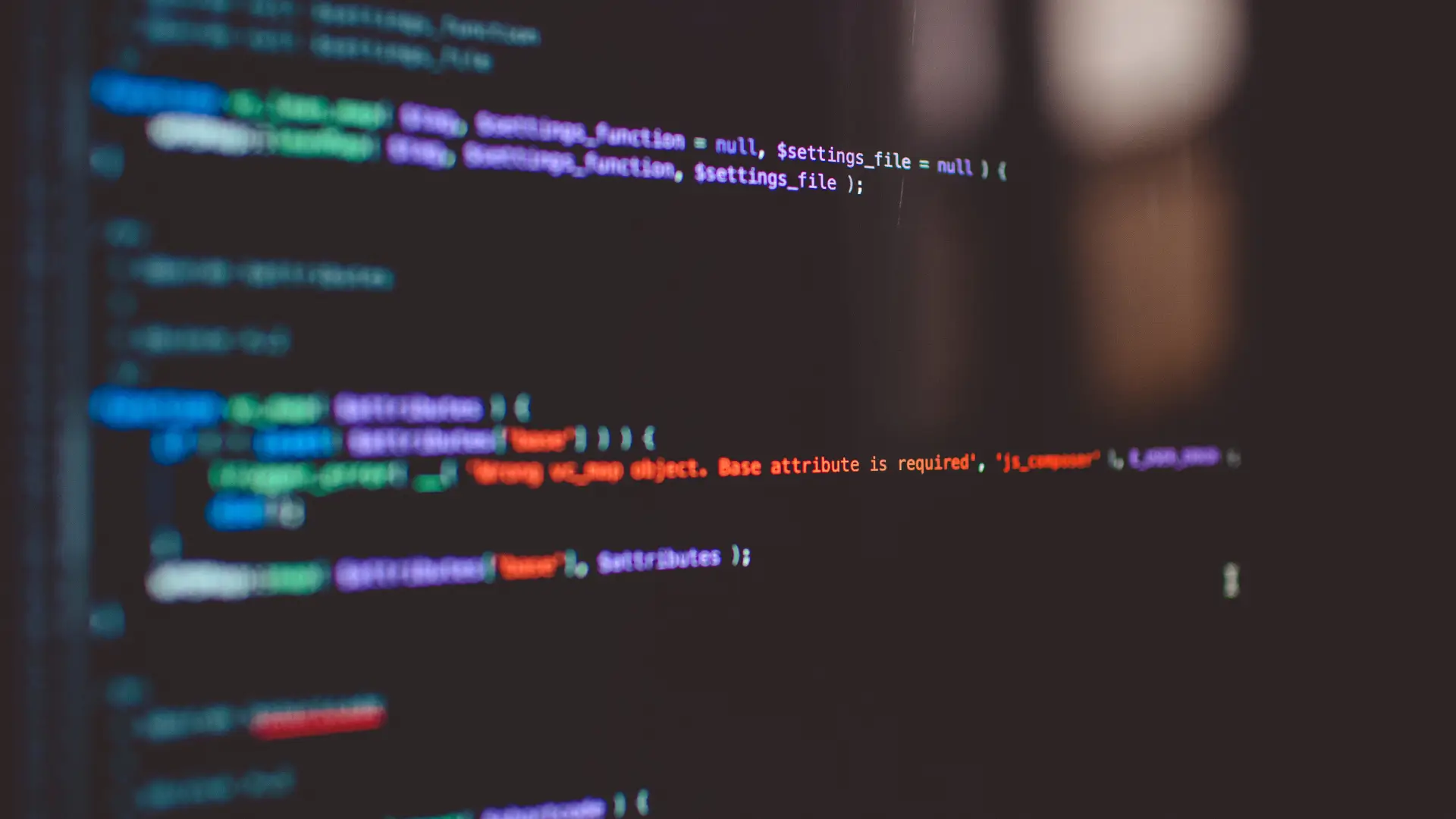 Computer screen displaying programming code with error message “Wrong vc_cmp object. Base attribute is required,” symbolizing software development and debugging.
